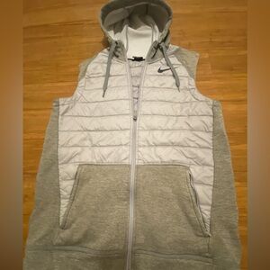 Nike vest with  hood ,White Logo,zip
Two front pockets,nylon & polyester.